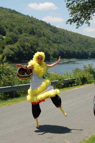 Digital photo photograph of NACL Theatre actress and artistic director Tannia Kowalchuk performs a stilt walking dance in Barryville, NY near the Upper Delaware River.