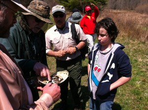 Digital photograph of volunteers examining the remains of a snapping turtle found on the site where the first Upper Delaware BioBlitz will be held on June 29, 2013.