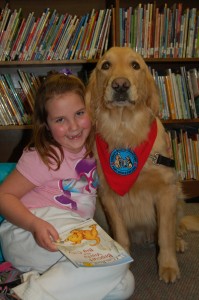 Photo of Davalyn Ursich of Honesdale, PA and her canine tutor, Sherman. Part of a program where kids read to dogs.