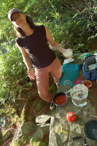 Photo by Sandy Long of Heron's Eye Communications Co-Founder Krista Gromalski making trail pizza with MSR gear.